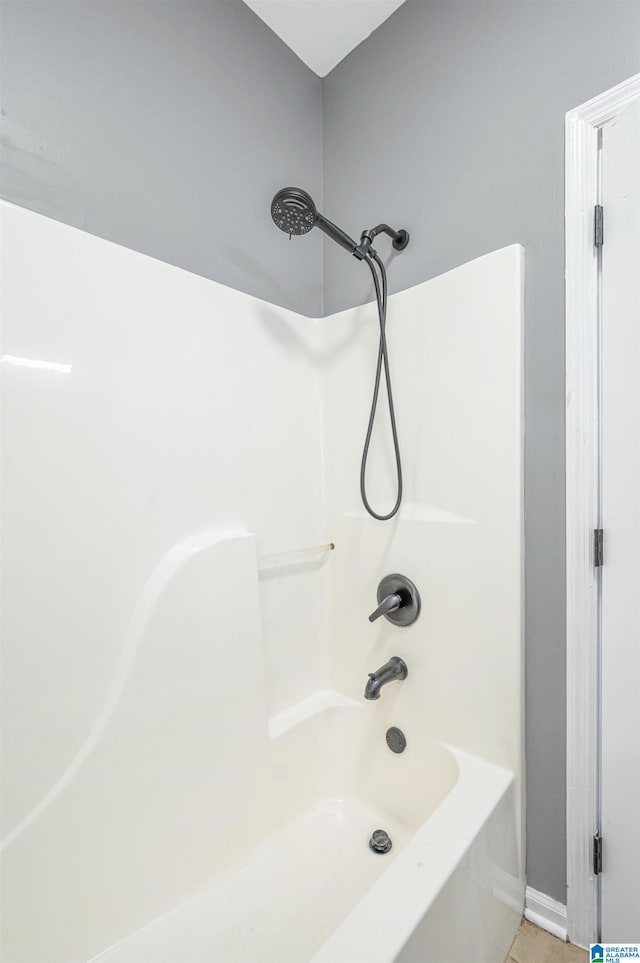 bathroom featuring tile patterned floors and shower / washtub combination