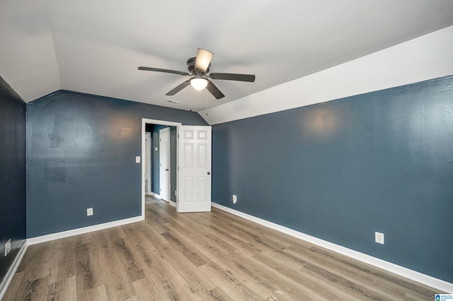 unfurnished room featuring ceiling fan, vaulted ceiling, and hardwood / wood-style floors