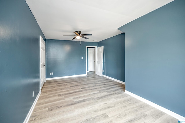 unfurnished room featuring ceiling fan and light wood-type flooring