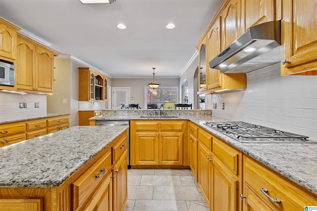 kitchen with glass insert cabinets, light stone countertops, stainless steel appliances, crown molding, and under cabinet range hood