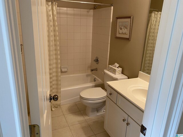 full bathroom with shower / bath combo with shower curtain, vanity, toilet, and tile patterned floors