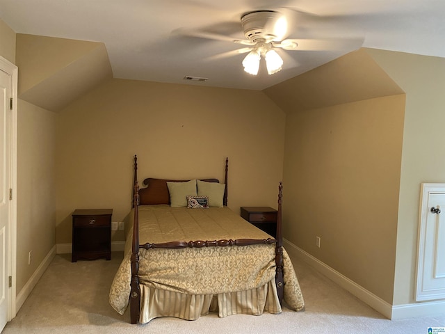 bedroom featuring baseboards, visible vents, vaulted ceiling, and light colored carpet