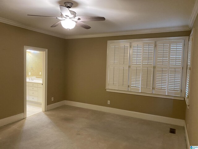 unfurnished room featuring visible vents, ornamental molding, carpet flooring, ceiling fan, and baseboards