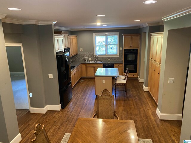 kitchen with dark wood-type flooring, a sink, backsplash, black appliances, and crown molding