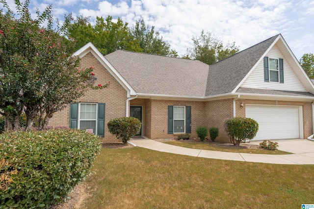 view of front of house with a front yard and a garage