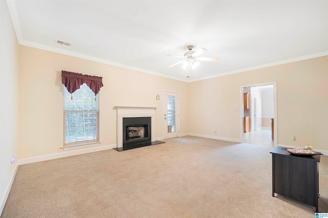 unfurnished living room with ornamental molding, light carpet, a healthy amount of sunlight, and ceiling fan