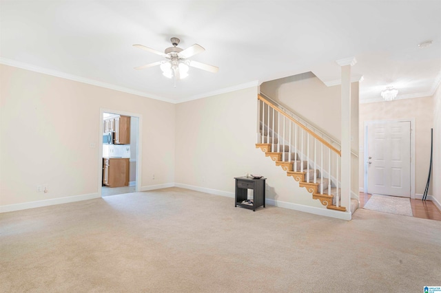 unfurnished living room featuring ornamental molding, light colored carpet, and ceiling fan