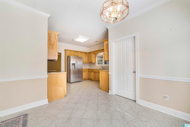 kitchen with light brown cabinetry, crown molding, a chandelier, light tile patterned flooring, and stainless steel fridge with ice dispenser