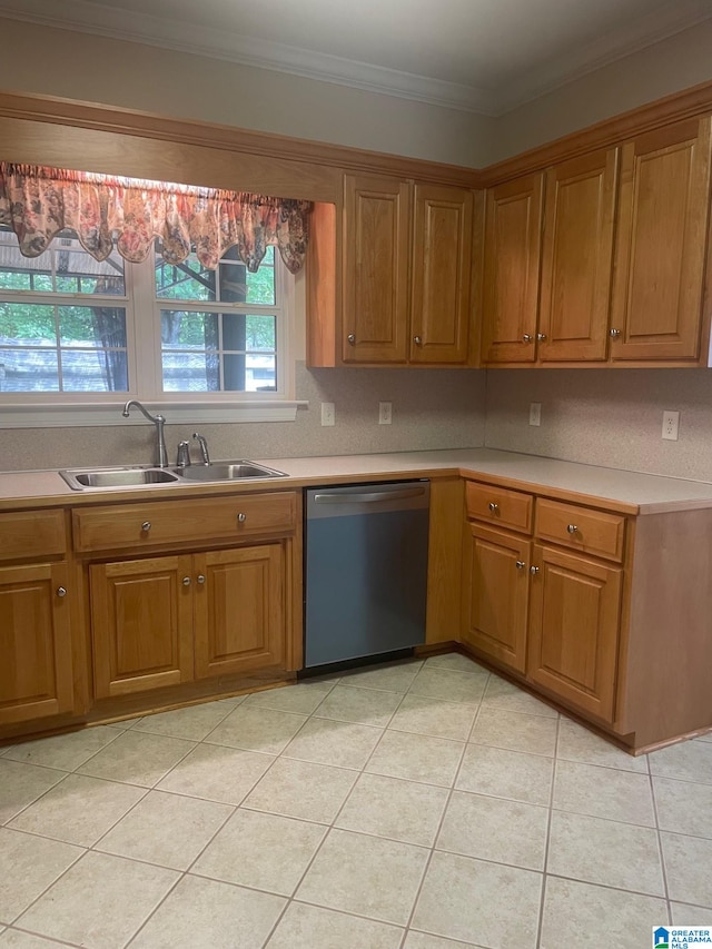 kitchen with light tile patterned floors, dishwasher, crown molding, and sink