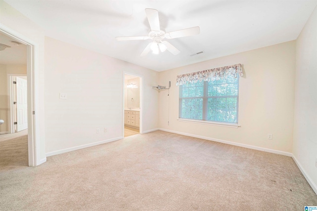 unfurnished room with ceiling fan and light colored carpet