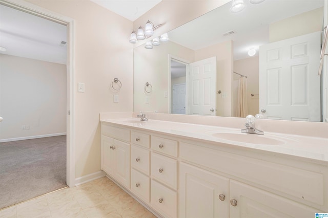 bathroom featuring vanity and walk in shower