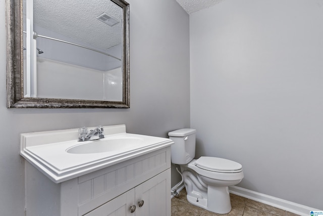 full bathroom with a textured ceiling, toilet, vanity, visible vents, and baseboards