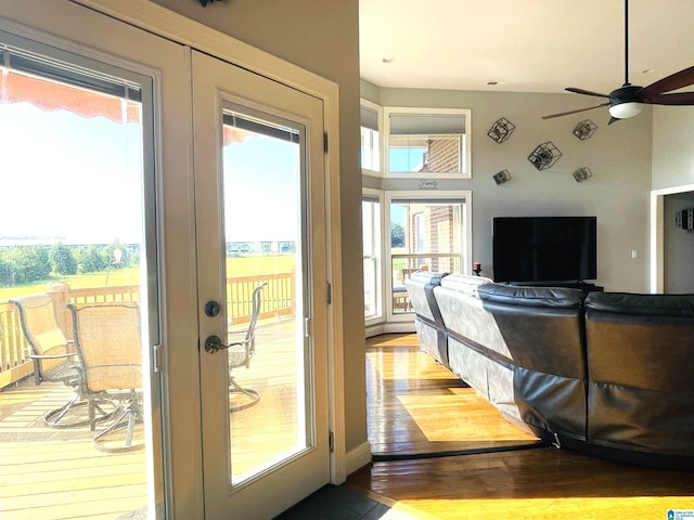 doorway featuring french doors, ceiling fan, and light wood-style flooring