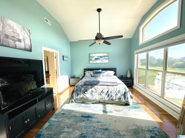 bedroom featuring ceiling fan, high vaulted ceiling, and dark wood-type flooring