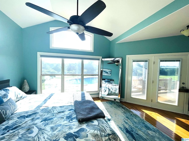 bedroom with ceiling fan, multiple windows, vaulted ceiling, and hardwood / wood-style flooring