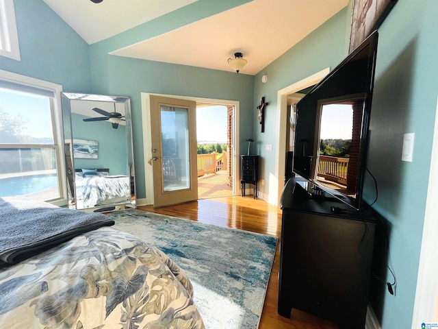 bedroom with hardwood / wood-style flooring, french doors, access to exterior, and lofted ceiling