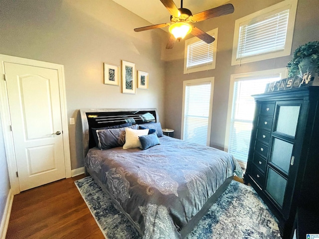 bedroom with ceiling fan and dark wood-type flooring