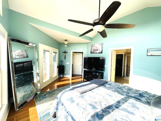 bedroom with ceiling fan, hardwood / wood-style flooring, french doors, and lofted ceiling