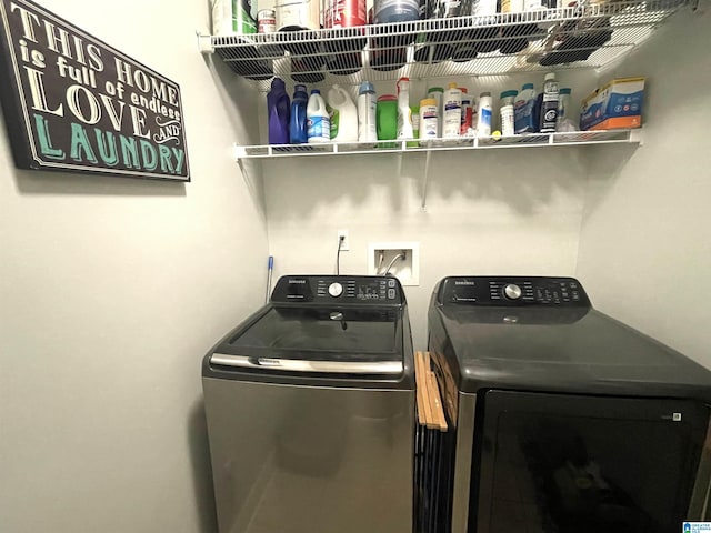 washroom featuring laundry area and separate washer and dryer