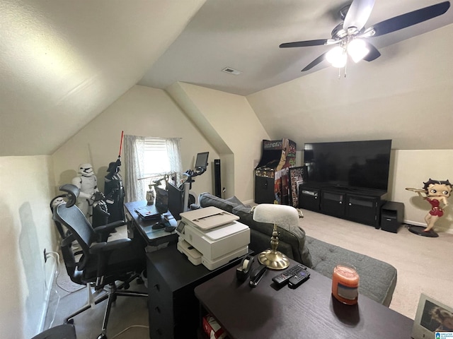 office space with lofted ceiling, visible vents, ceiling fan, and carpet