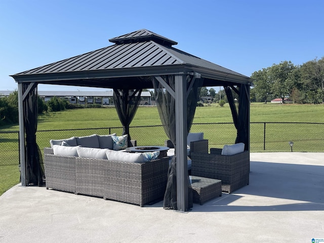 view of patio / terrace featuring an outdoor hangout area, a gazebo, and fence