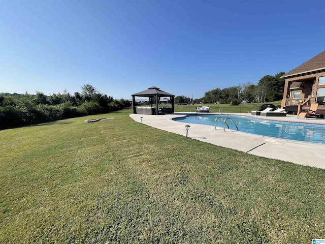 view of pool with a lawn and a gazebo