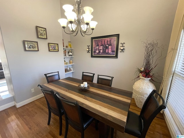 dining space featuring a chandelier and wood-type flooring