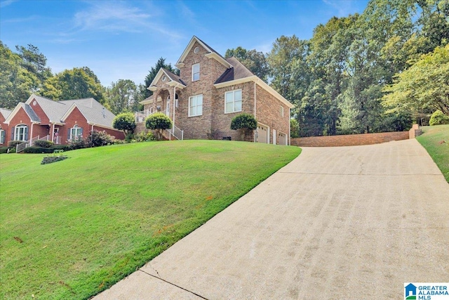 view of front of home with a front lawn and a garage