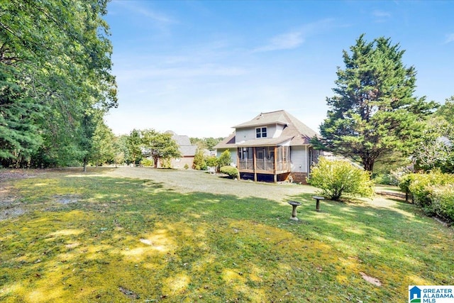 view of yard with a sunroom