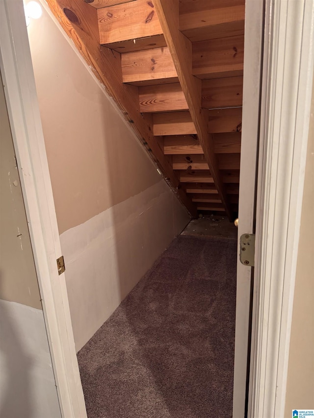 interior space featuring carpet flooring and wood ceiling