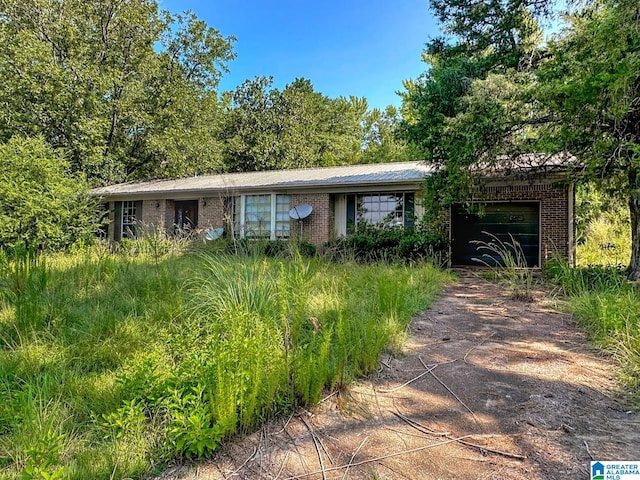 single story home featuring a garage