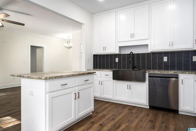 kitchen featuring stainless steel dishwasher, tasteful backsplash, sink, ceiling fan with notable chandelier, and dark wood-type flooring