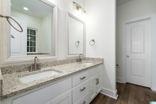 bathroom with hardwood / wood-style flooring and vanity