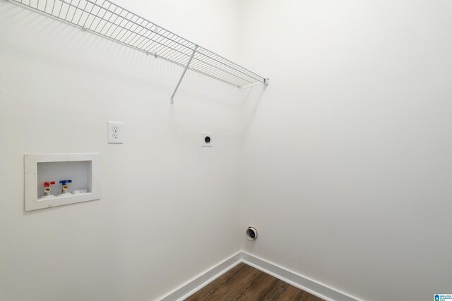 laundry area with hookup for an electric dryer, hardwood / wood-style flooring, and washer hookup