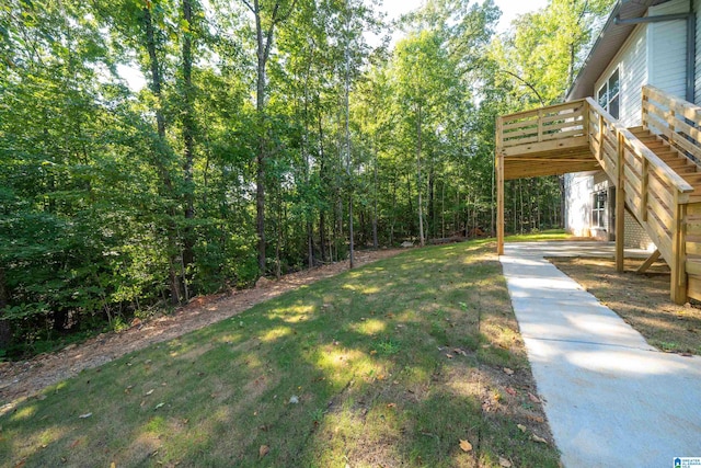 view of yard featuring a wooden deck