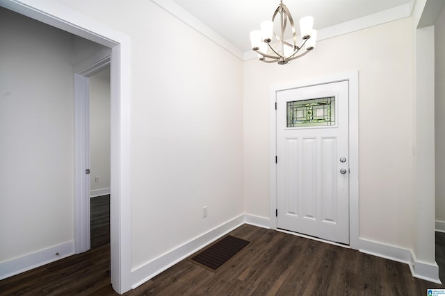 entryway featuring dark hardwood / wood-style floors and a chandelier