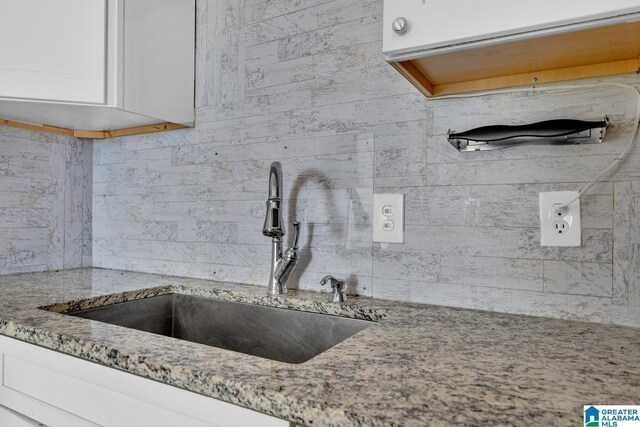 kitchen with sink, light hardwood / wood-style flooring, and a textured ceiling