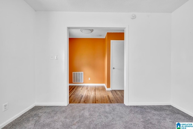 empty room with wood-type flooring