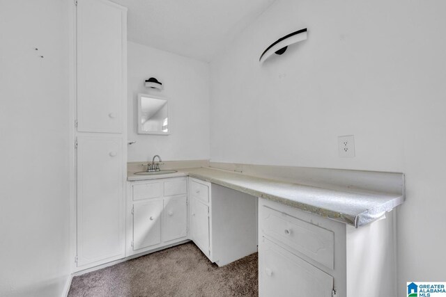 carpeted spare room with a textured ceiling