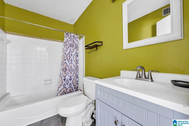 full bathroom featuring hardwood / wood-style flooring, a textured ceiling, vanity, toilet, and shower / bathtub combination with curtain