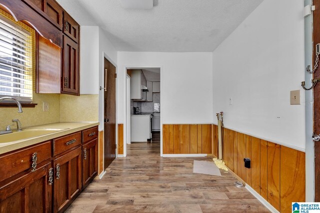 unfurnished bedroom with carpet, multiple windows, and two closets