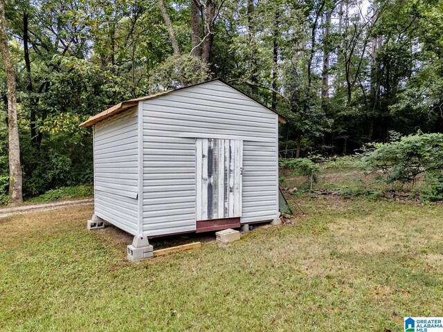 split level home featuring a wooden deck and a front yard