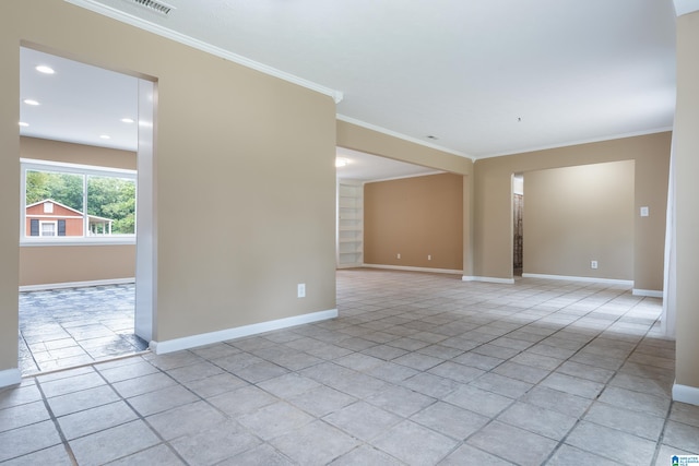 tiled spare room with ornamental molding