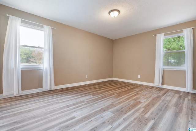 unfurnished room featuring light wood-type flooring