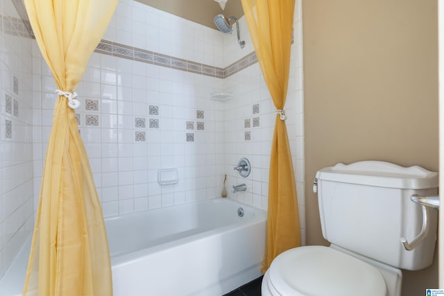 bathroom featuring toilet and shower / bath combo