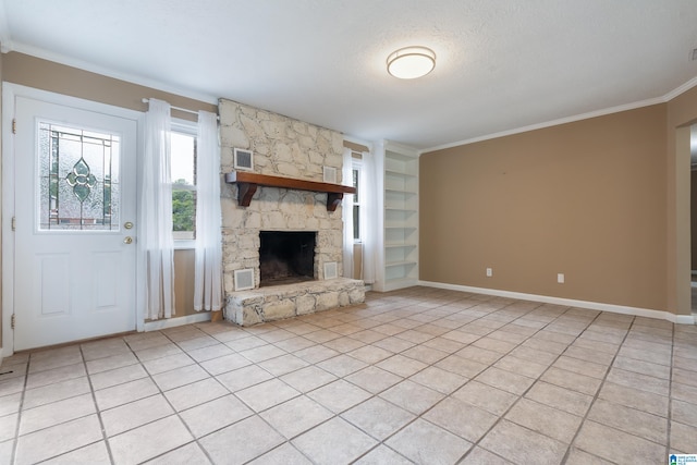 unfurnished living room featuring light tile patterned flooring, a stone fireplace, ornamental molding, built in shelves, and a textured ceiling