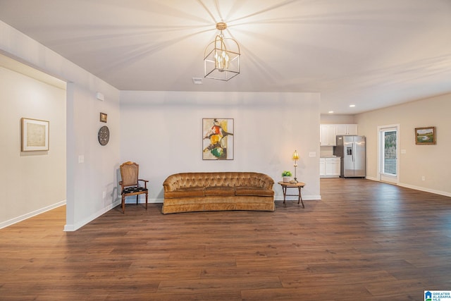 sitting room featuring baseboards, dark wood finished floors, and recessed lighting