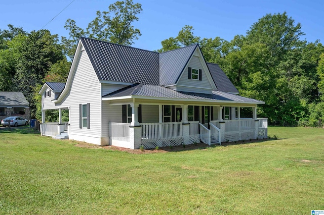 view of front facade featuring a front yard and covered porch