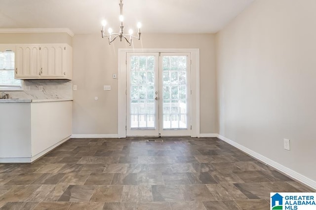 unfurnished dining area featuring a notable chandelier, plenty of natural light, and tile patterned floors