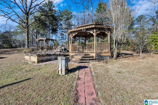 view of yard featuring a garden and a gazebo